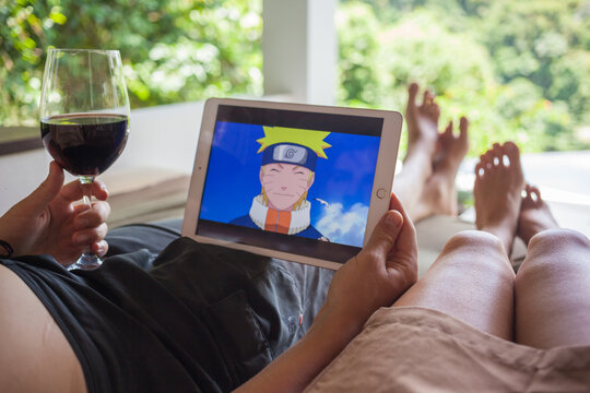 Couple Watching Naruto Anime Series Using Ipad.