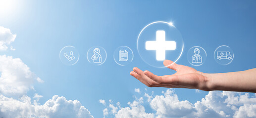 Businessman hold virtual plus medical network connection icons. Covid-19 pandemic develop people awareness and spread attention on their healthcare.Doctor,document,medicine,ambulance,patient icon.