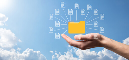 Document Management System DMS .Businessman hold folder and document icon.Software for archiving,...