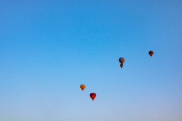 Hot air balloons on the sky in the morning. Magical view with hot air balloons.