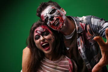 Scary zombies on color background