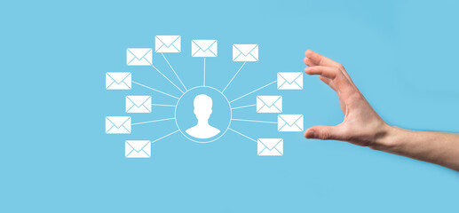 Male hand holding letter icon,email icons .Contact us by newsletter email and protect your personal information from spam mail. Customer service call center contact us.Email marketing and newsletter