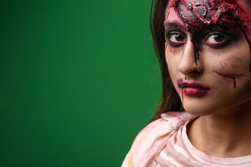 Scary zombie woman on color background
