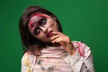 Scary zombie woman on color background