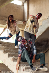 Scary zombies in ruined building
