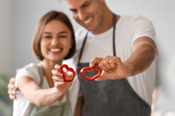 Young couple cooking in kitchen. Vegan Day