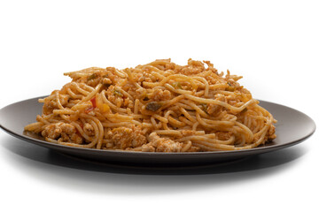 Plate covered with delicious Italian spaghetti, with tomato sauce. Isolated on white background. Healthy life concept.