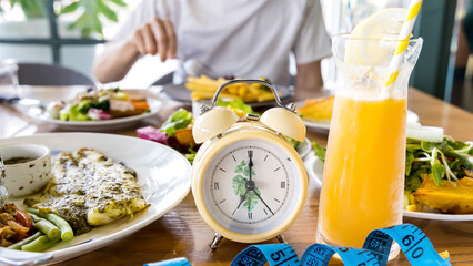 Selective focus of Alarm clock for Intermittent fasting concept, clock with eating and fasting...