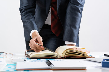 Businessman analyzing financial documents at desk