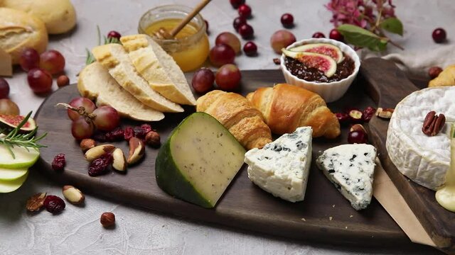 Cheese assortment on dark background.