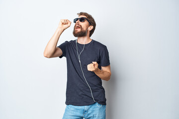 handsome man headphones sunglasses music dance fun isolated background