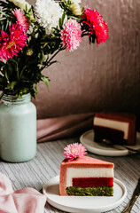 A piece of mousse spinach strawberry cake. Focus on the part  of piece of cake. 