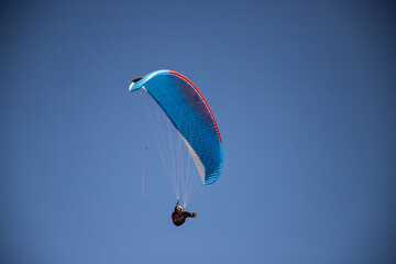 glider paragliding g against blue sky flying  adrenaline and freedom concept