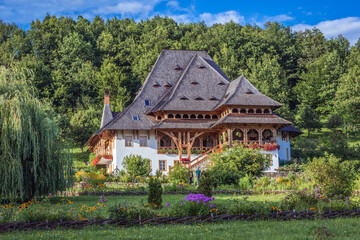 Fototapeta na wymiar Wooden building in Barsana Monastery in Maramures region, Romania