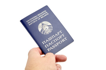 Passport of Republic of Belarus with blue cover in hand isolated on white