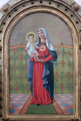 Fototapeta premium Immaculate Heart of Mary, altarpiece on the Virgin Mary altar in the Church of Saint Barbara in Carevdar, Croatia