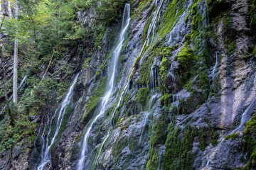 Fototapeta na wymiar wimbachklamm in Bavaria, germany with waterfalls and moose rocks
