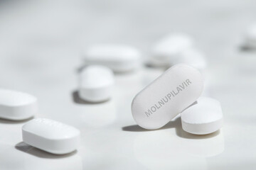 Molnupiravir covid-19 antiviral drug.Molnupiravir pill on white background.Concept of coronavirus covid-19 antiviral