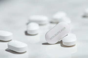 Molnupiravir covid-19 antiviral drug.Molnupiravir pill on white background.Concept of coronavirus...