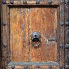 antique wooden door with brass door handle 