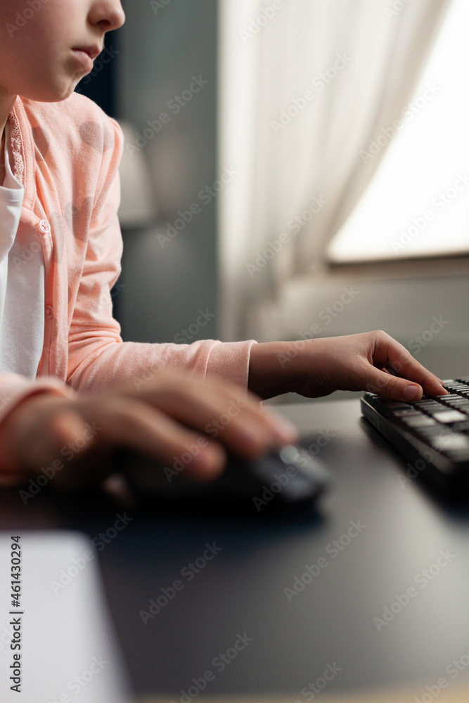 Poster closeup of little schoolkid hands using computer for distance education studying literature during o