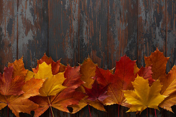 Autumn leaves on rustic wooden table. Flat lay, top view, copy space. Autumn concept.