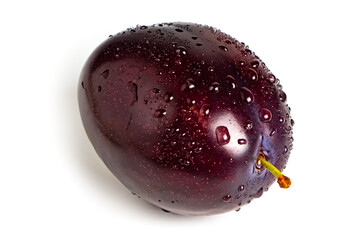 Plum with drops isolated on white background. Plum fruit