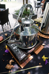 large tea kettles and a sprinkling of natural spices served on the table 