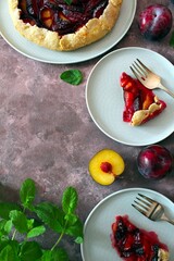 Tasty galetta with plums. Top view with copy space. Healthy food.