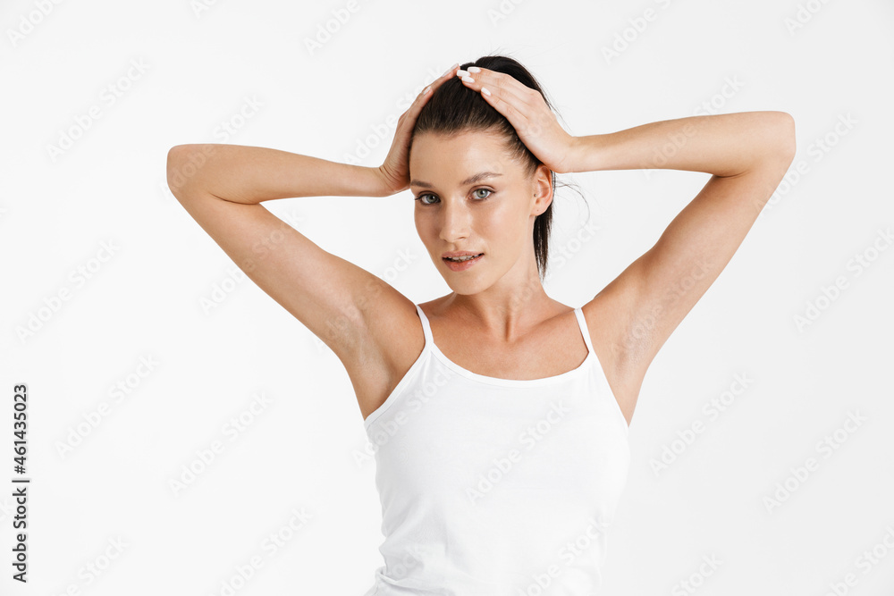 Wall mural european woman wearing underwear holding her head and looking at camera