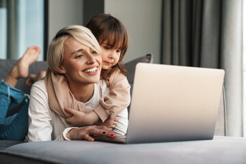 Happy young mother and her little daughter