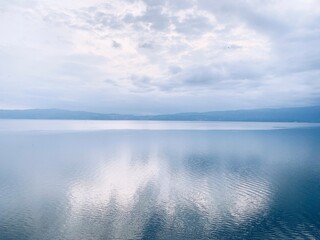 Fototapeta na wymiar Sky reflection on the perfect surface of the lake