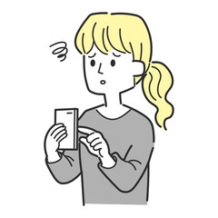 スマホを操作しながらがっかりしている女性