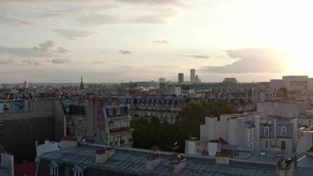 Rising drone shot of Eastern Paris at sunset
