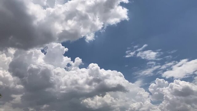 Building motions clouds. Puffy fluffy white clouds sky time lapse. slow moving clouds.Footage Cloudscape timelapse cloudy. footage timelapse nature 4k. background worship christian concept.