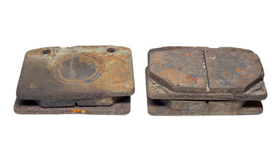Set of old worn and rusty brake pads, dismantled from car. isolated on white background