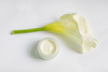 Cream in a jar on a white background