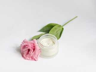 Cream in a jar on a white background