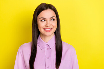 Portrait of attractive cheerful curious girl thinking copy space ad isolated over bright yellow color background