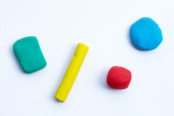 Colorful plasticine clay on white background.
