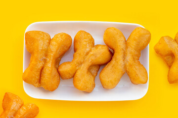 Deep-fried dough sticks or chinese bread sticks on white background.