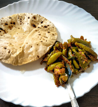 Indian Vegetable parwal Curry and Chapati - Homemade chapati (Indian bread) served with Indian parwal curry.