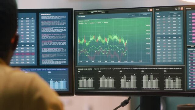 Black trader analyzing financial data