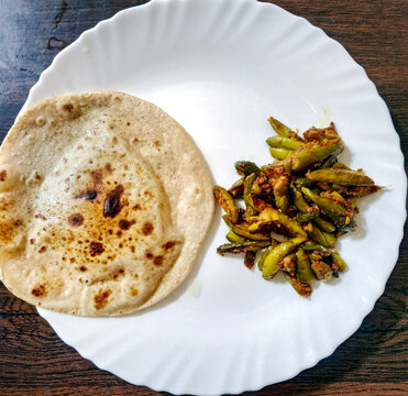 Indian Vegetable parwal Curry and Chapati - Homemade chapati (Indian bread) served with Indian parwal curry.