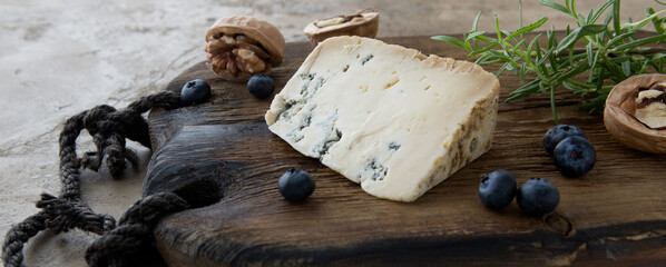 gorgonzola cheese on wooden board - obrazy, fototapety, plakaty