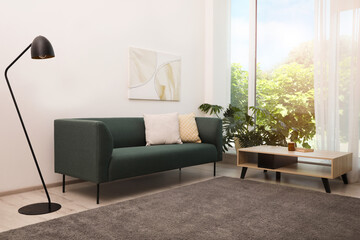 Living room interior with soft grey carpet and modern furniture