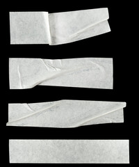 Collage white pieces of scotch tape isolated on a black background.  set stripes of masking tape....