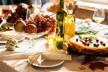 Close-up festive decorated table with roasted turkey and holiday traditional food, dishes. Happy Thanksgiving day