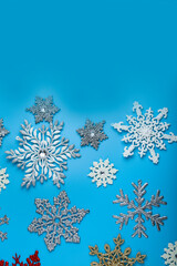 Border from snowflakes on a blue background.