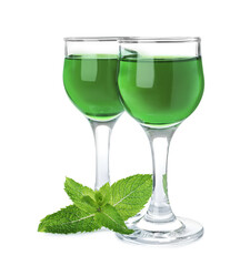 Delicious mint liqueur and fresh leaves on white background